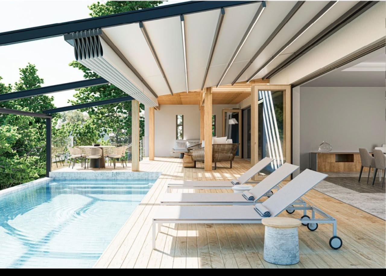 Motorised retractable pergola over a poolside terrace