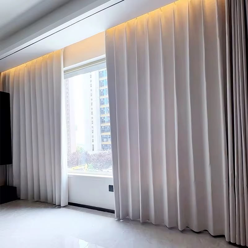 Motorised sheer curtains framing a floor-to-ceiling window