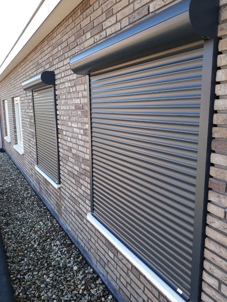 Motorised security roller shutter