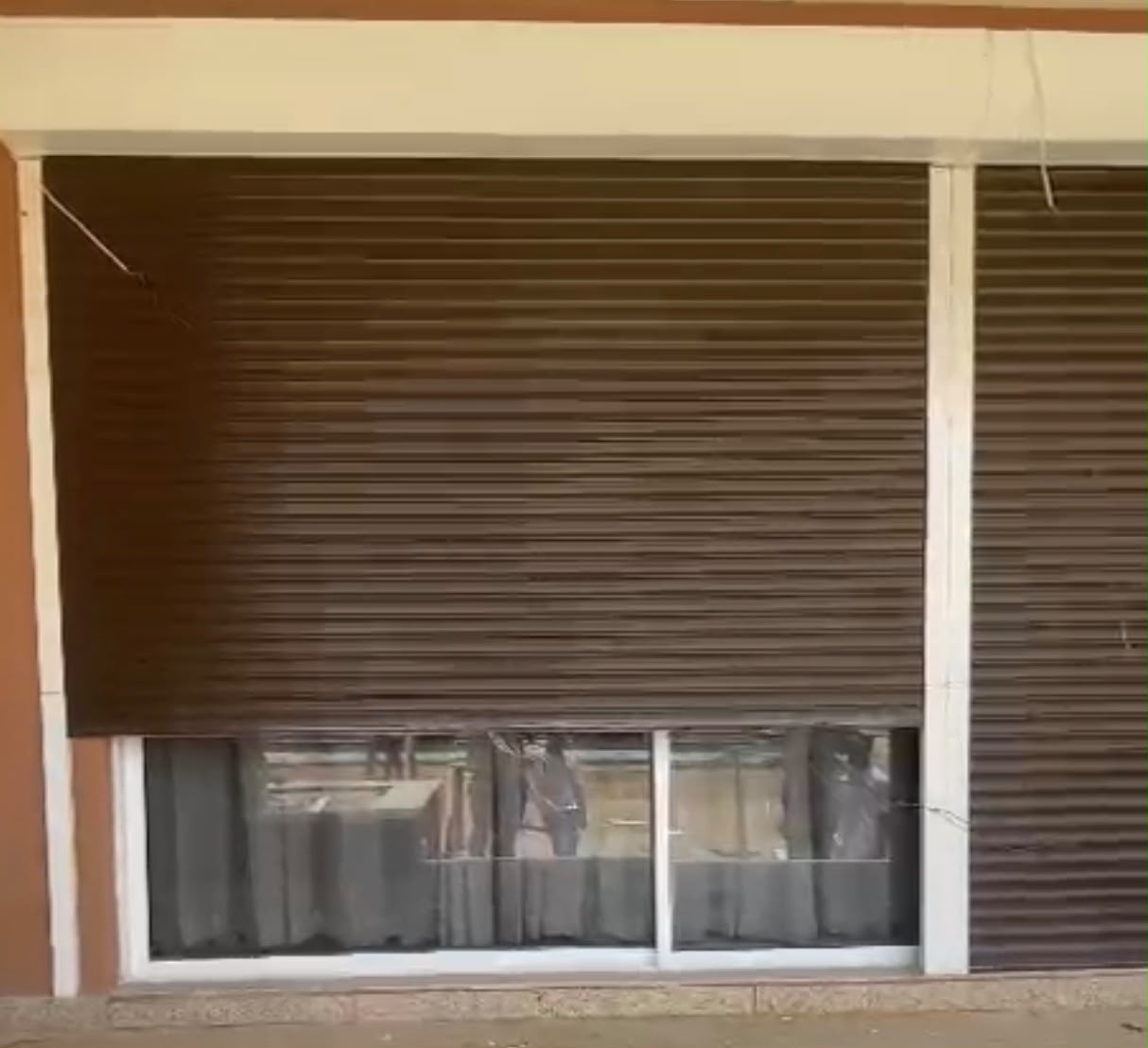 Motorised security roller shutter