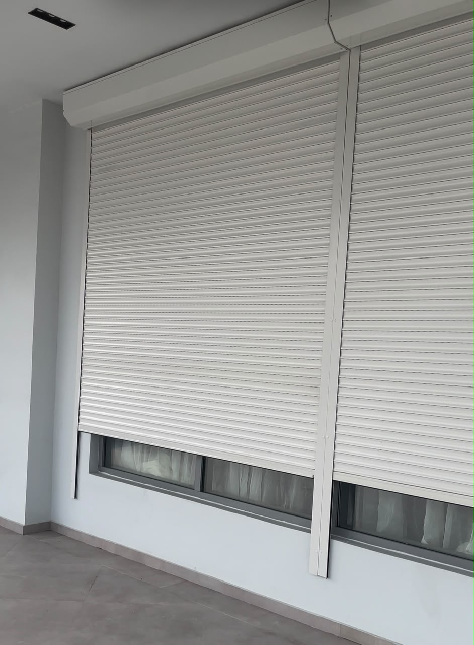 Motorised security roller shutter