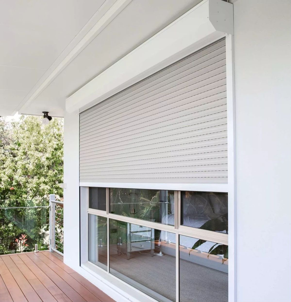 Motorised security roller shutter