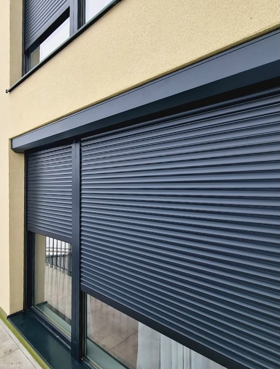 Motorised security roller shutter