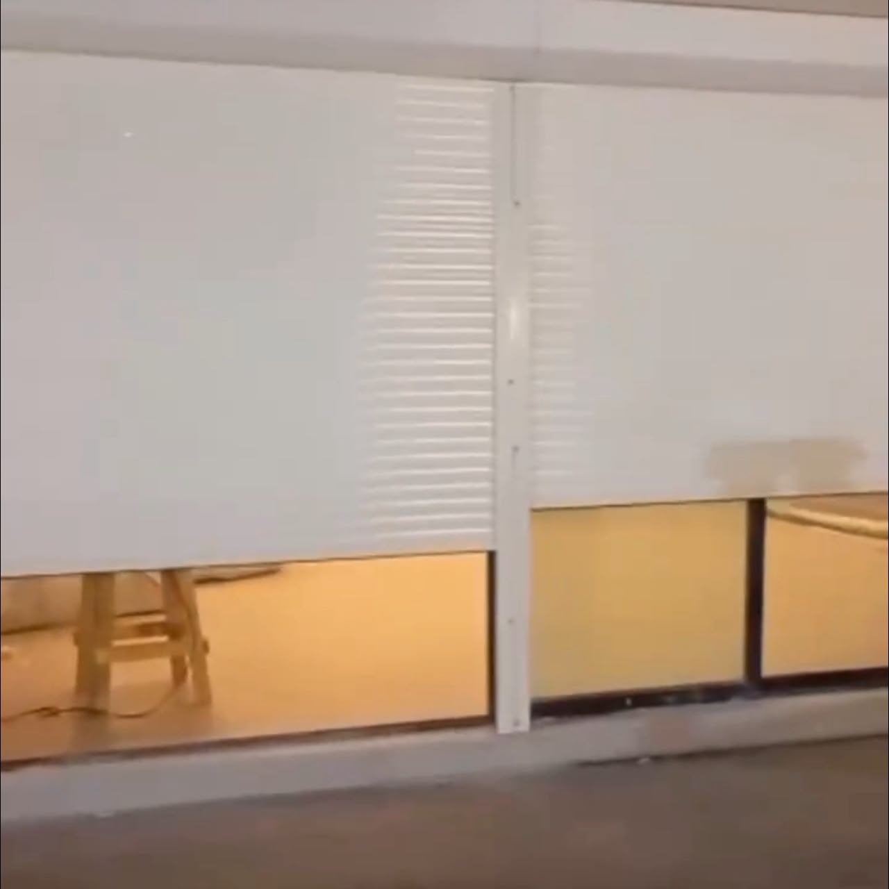 Motorised security roller shutter