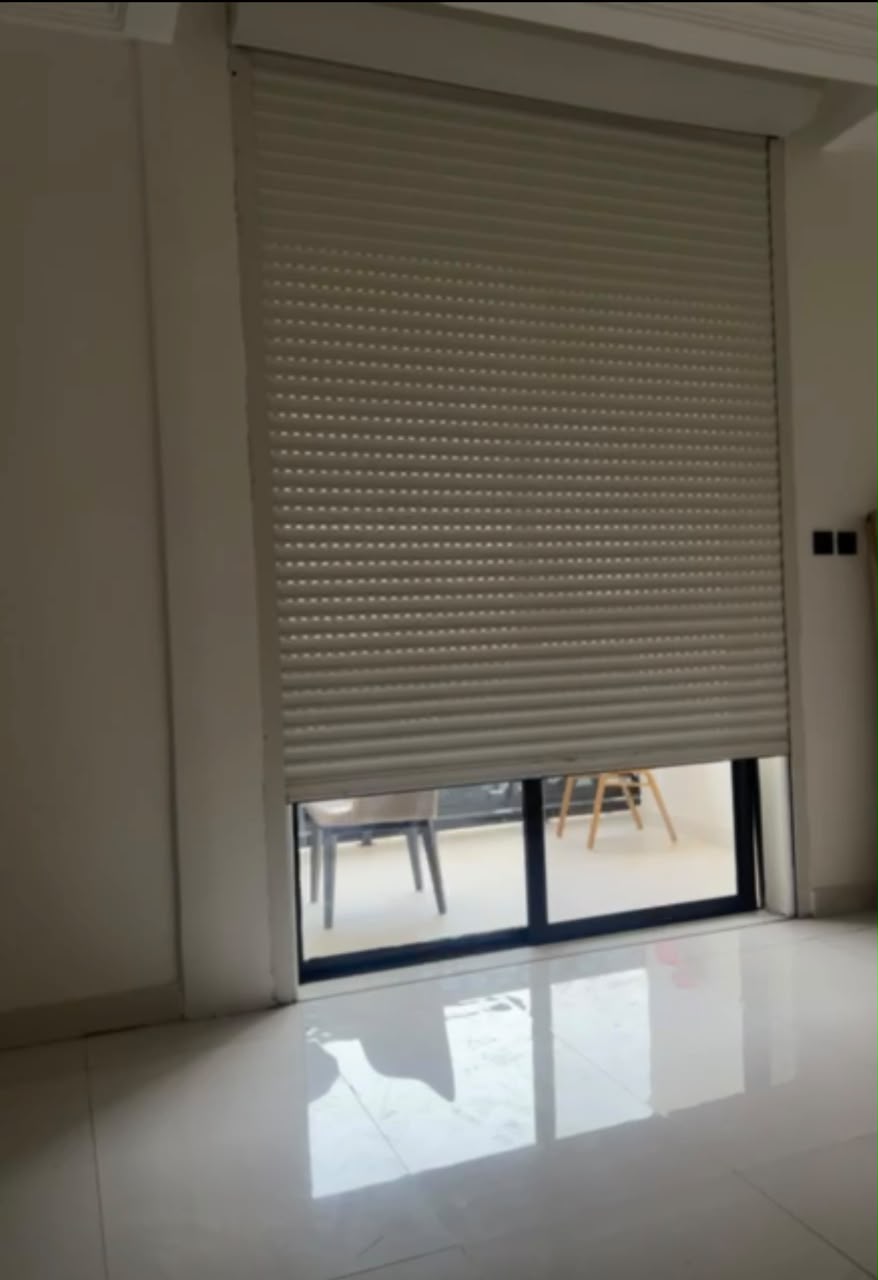 Motorised security roller shutter